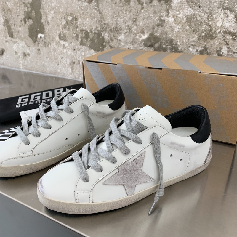 golden goose men’s S*per-star sneakers with suede star and black heel tab