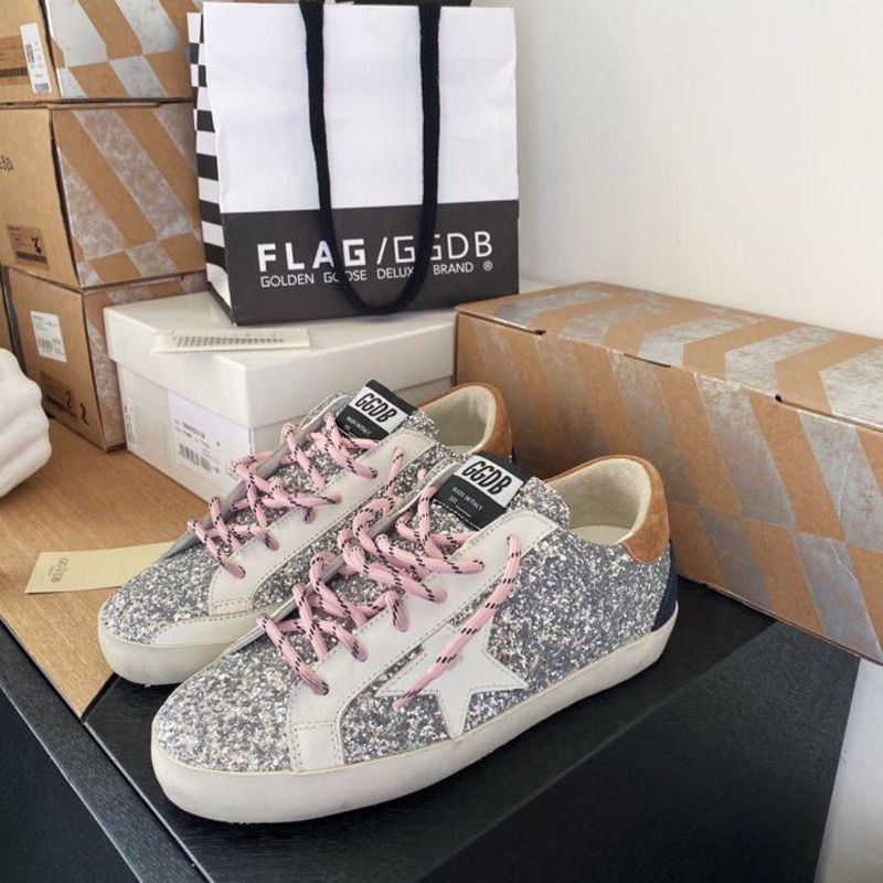 golden goose men’s S*per-star sneakers with sliver glitter and brown heel tab