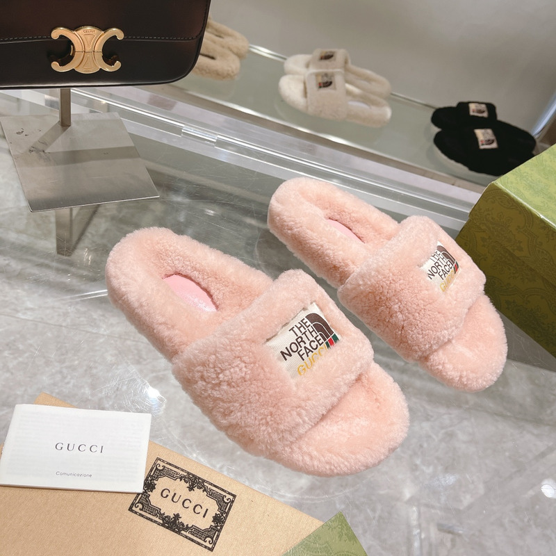g*u*i x the n0*h F**e shearling slides light pink