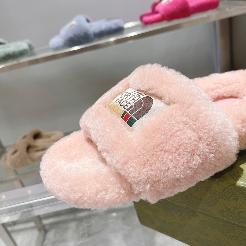g*u*i x the n0*h F**e shearling slides light pink