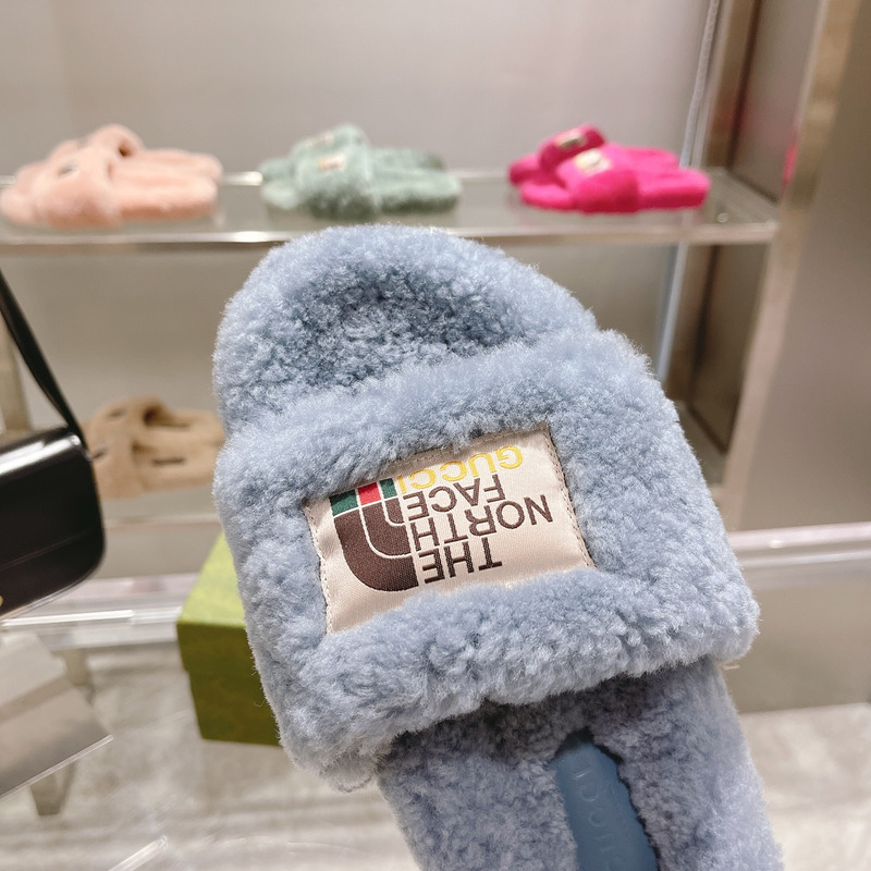 g*u*i x the n0*h F**e shearling slides blue