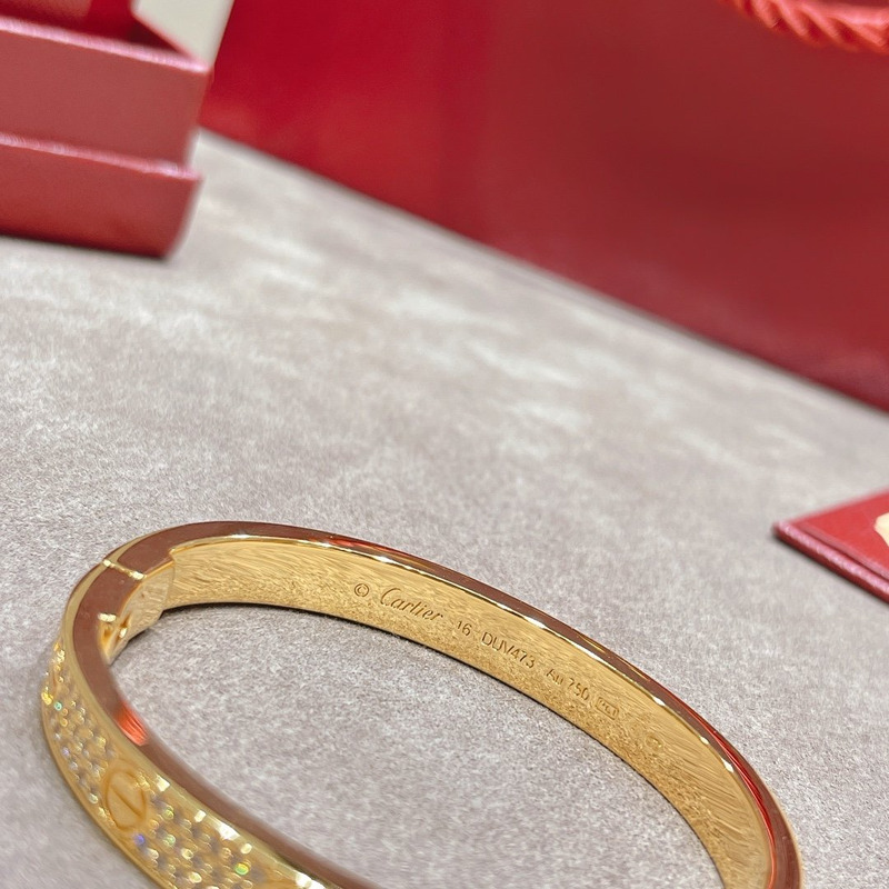 cartier Di*m*nd paved love bangle bracelet in yellow gold