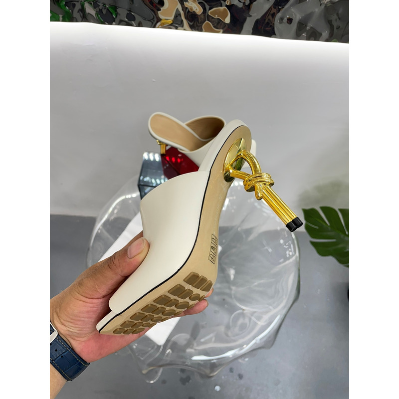 Bo*te*ga ve*ne*ta knot mule with gold finished metal knot heel beige