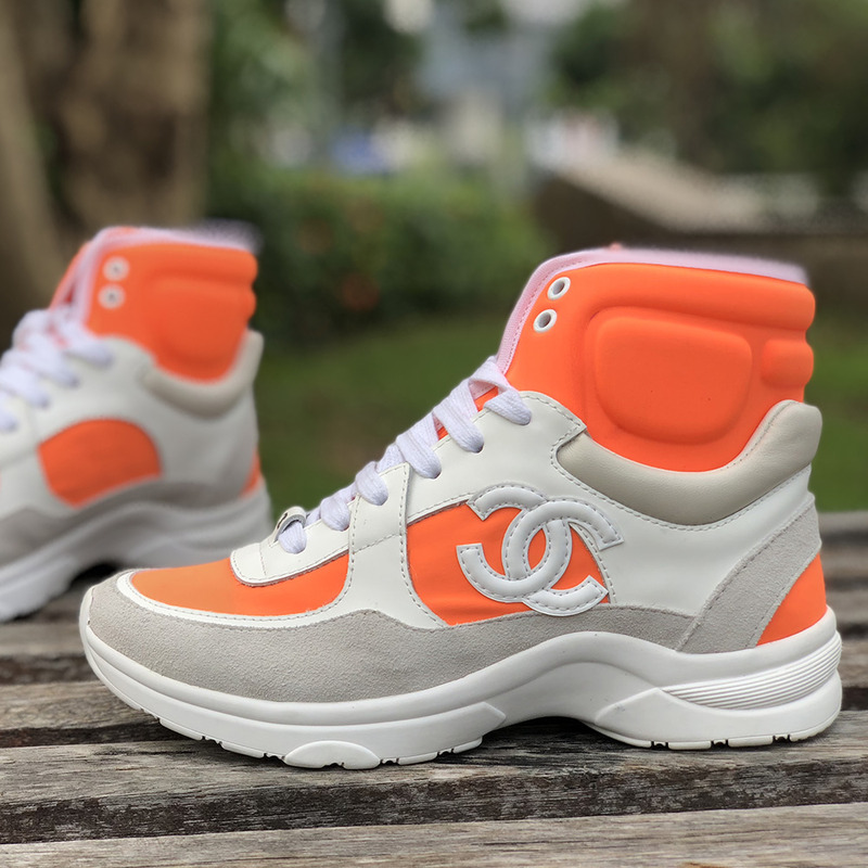 Ch*el calfskin & velvet high top sneaker in orange & white