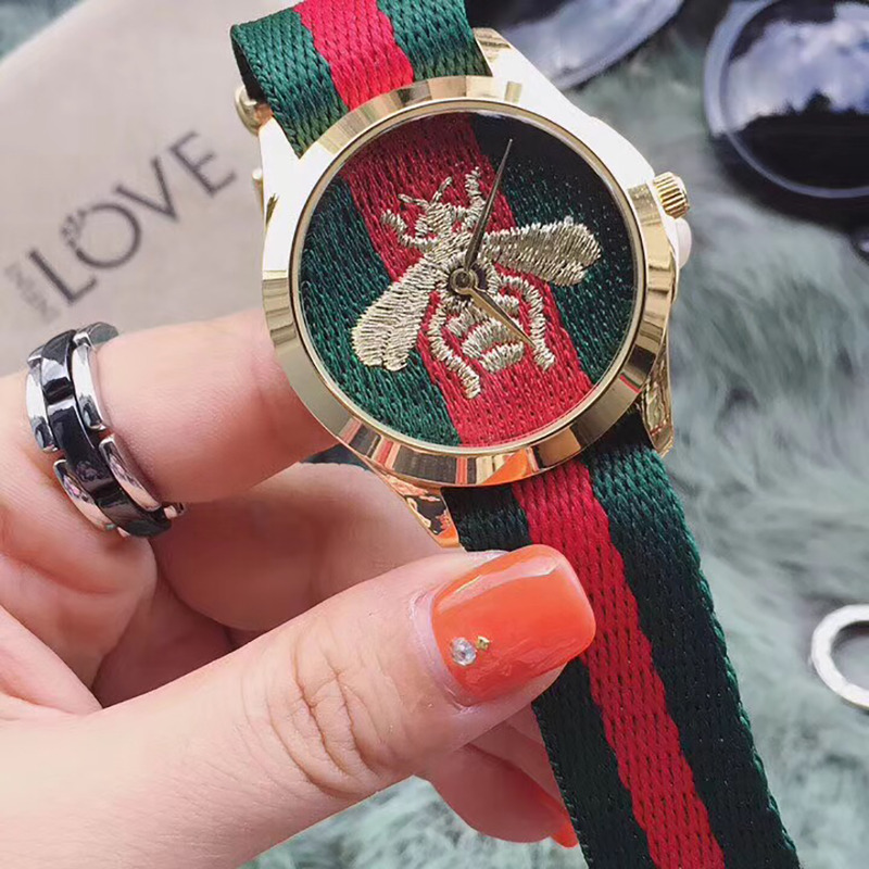 G*u*i red and green web watches with bee embroidery