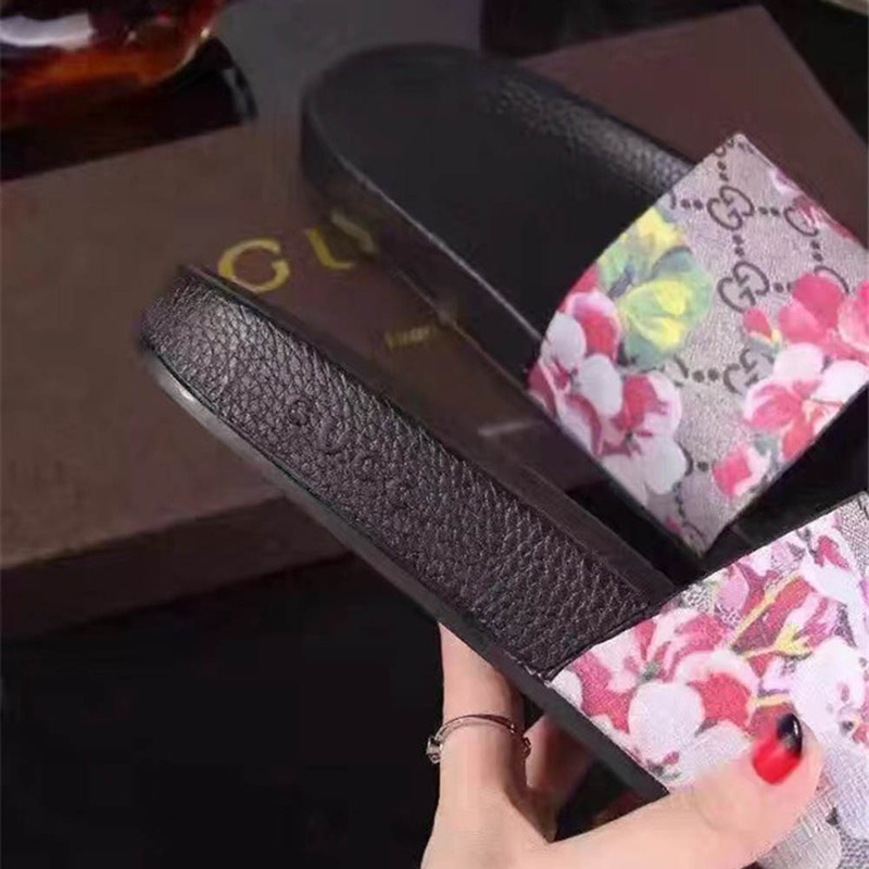 G*u*i bird and flower flip flops